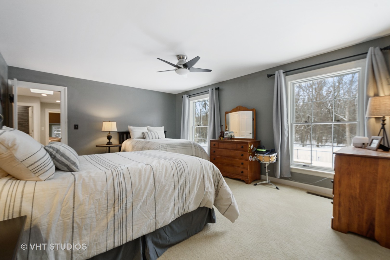 6814 Red Barn Road Crystal Lake, IL 60012 - Photo 29 of 50 a bedroom with a large bed and a chandelier