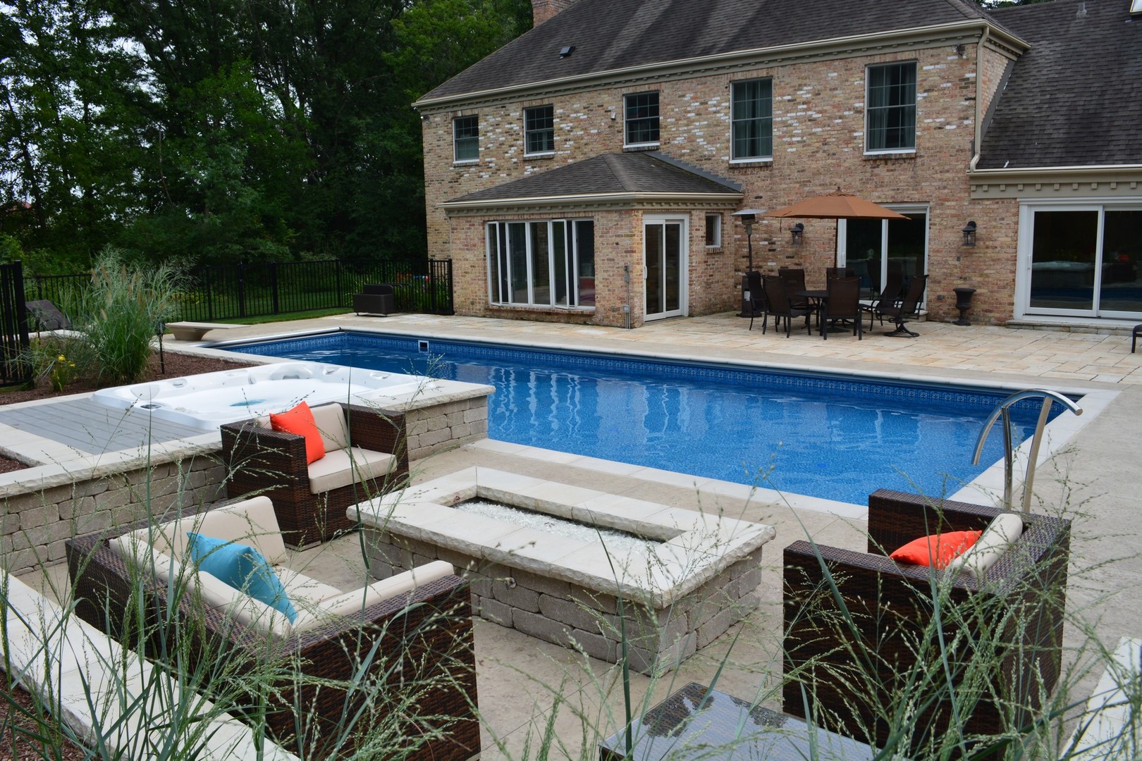 6814 Red Barn Road Crystal Lake, IL 60012 - Photo 42 of 50 a view of a house with pool and chairs in patio