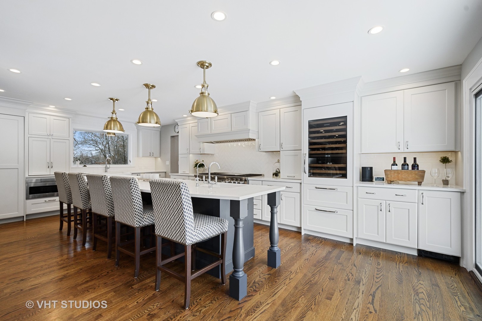 6814 Red Barn Road Crystal Lake, IL 60012 - Photo 8 of 50 a kitchen with stainless steel appliances kitchen island granite countertop a sink a stove a table and chairs