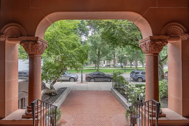 a couple of potted plants in front of a building