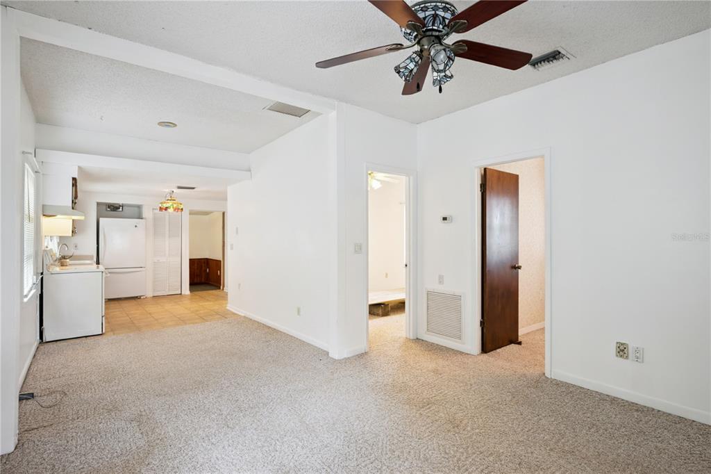 420 Jacks Memorial Road St. Cloud, FL 34769 - Photo 8 of 31 a view of a livingroom with a ceiling fan and entryway