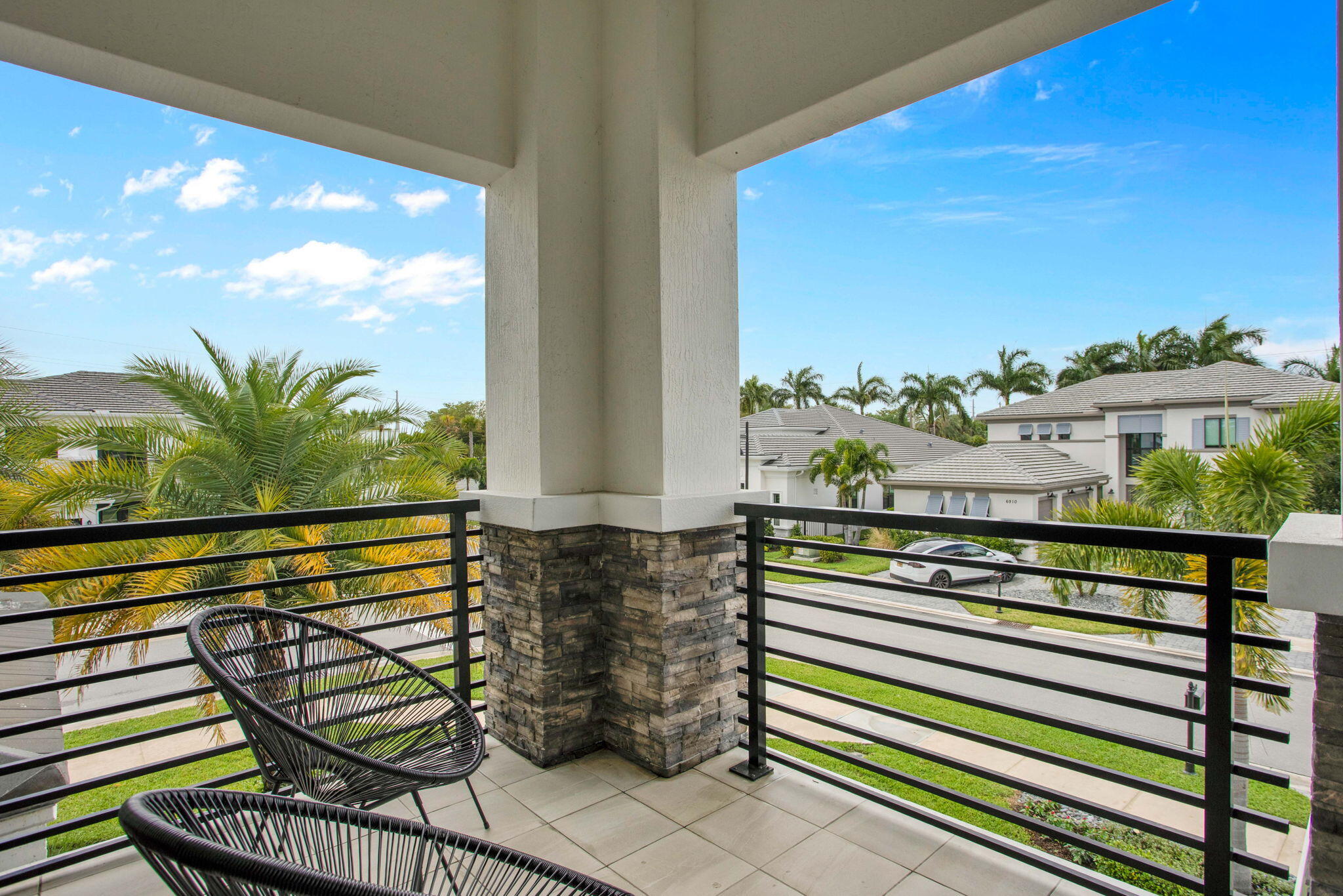 6903 Northwest 28th Avenue Boca Raton, FL 33496 - Photo 50 of 69 a view of a balcony with chairs and wooden floor