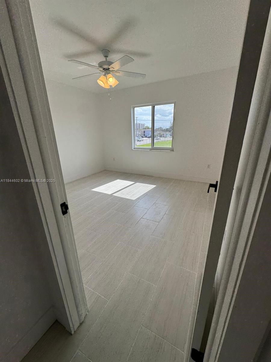 800 Northwest 44th Avenue, Unit 4 Miami, FL 33126 - Photo 7 of 9 a view of a livingroom with a window