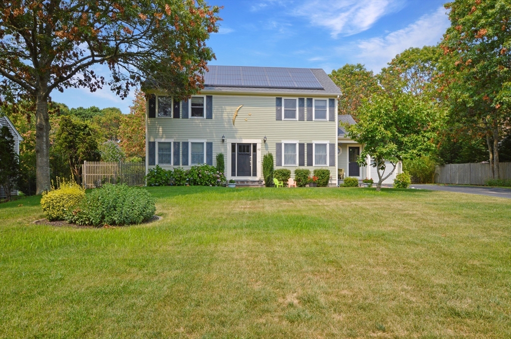 48 Tara Terrace Bourne, MA 02532 - Photo 2 of 33 a front view of house with yard and green space