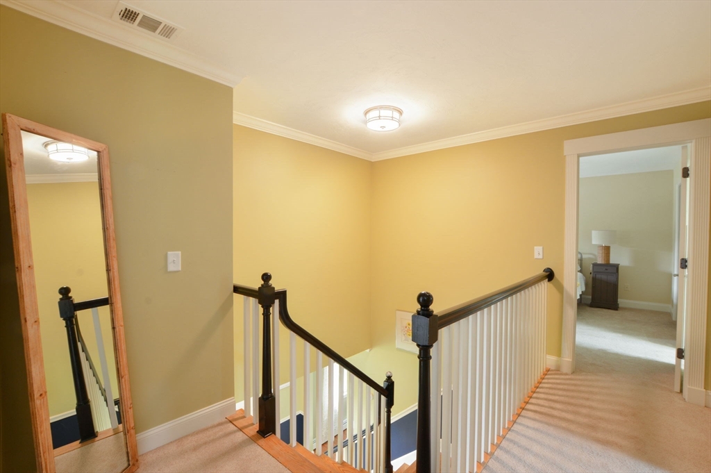 48 Tara Terrace Bourne, MA 02532 - Photo 24 of 33 a view of a hallway with wooden floor and staircase