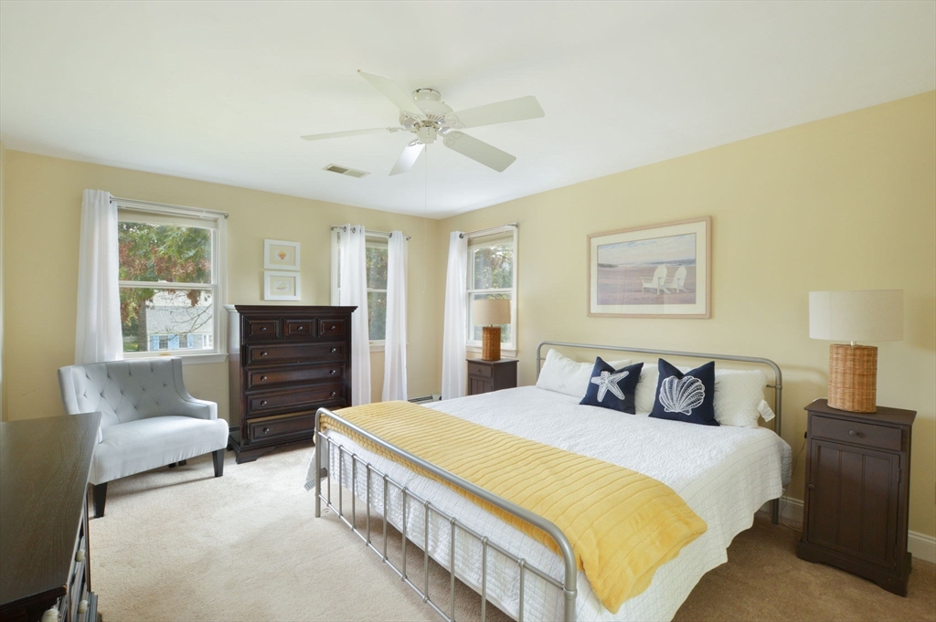 48 Tara Terrace Bourne, MA 02532 - Photo 25 of 33 a bedroom with a bed and dresser