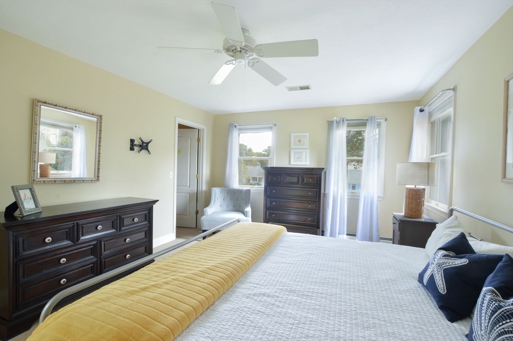 48 Tara Terrace Bourne, MA 02532 - Photo 26 of 33 a bedroom with a bed and a dresser