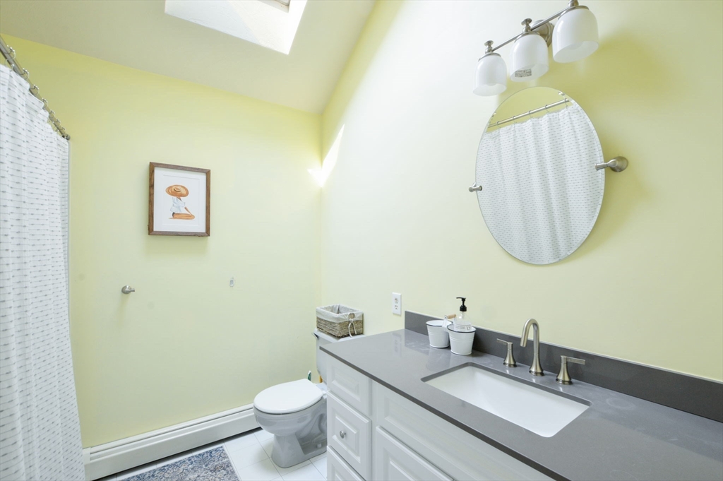 48 Tara Terrace Bourne, MA 02532 - Photo 27 of 33 a bathroom with a sink and a mirror