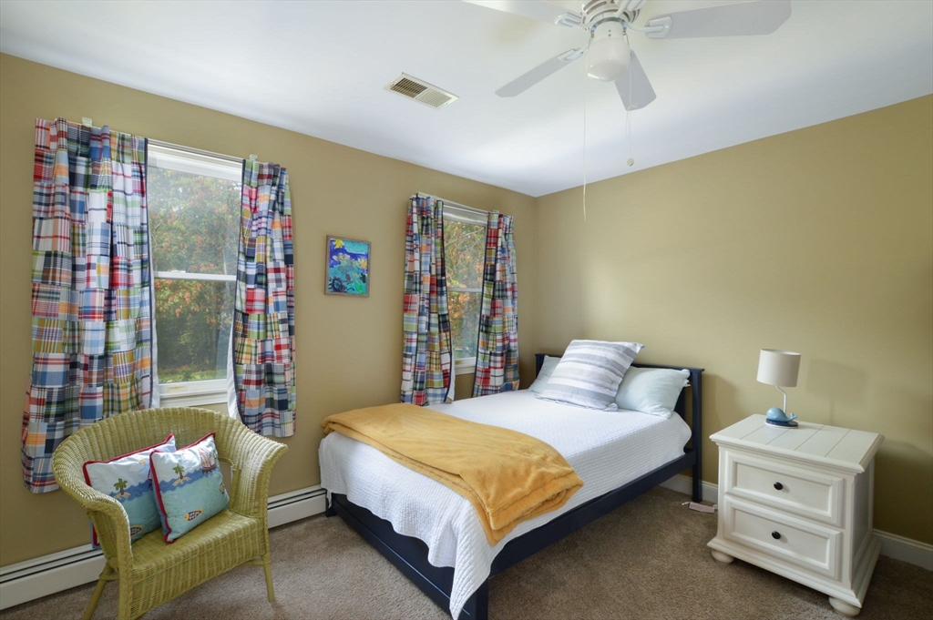 48 Tara Terrace Bourne, MA 02532 - Photo 28 of 33 a bedroom with a bed and a couch