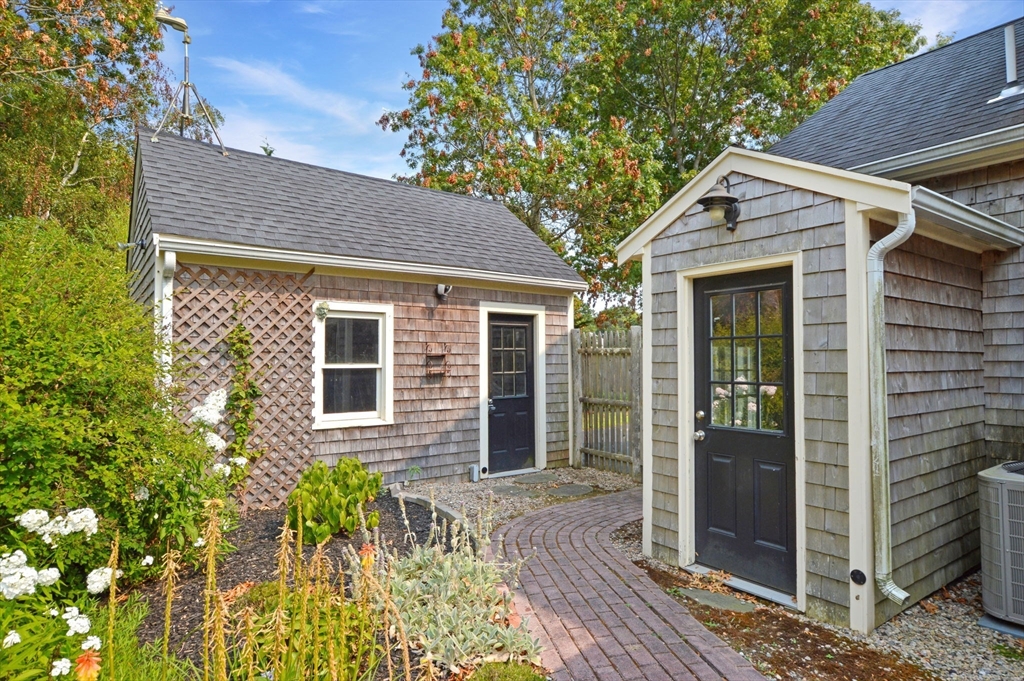 48 Tara Terrace Bourne, MA 02532 - Photo 31 of 33 a front view of a house with garden