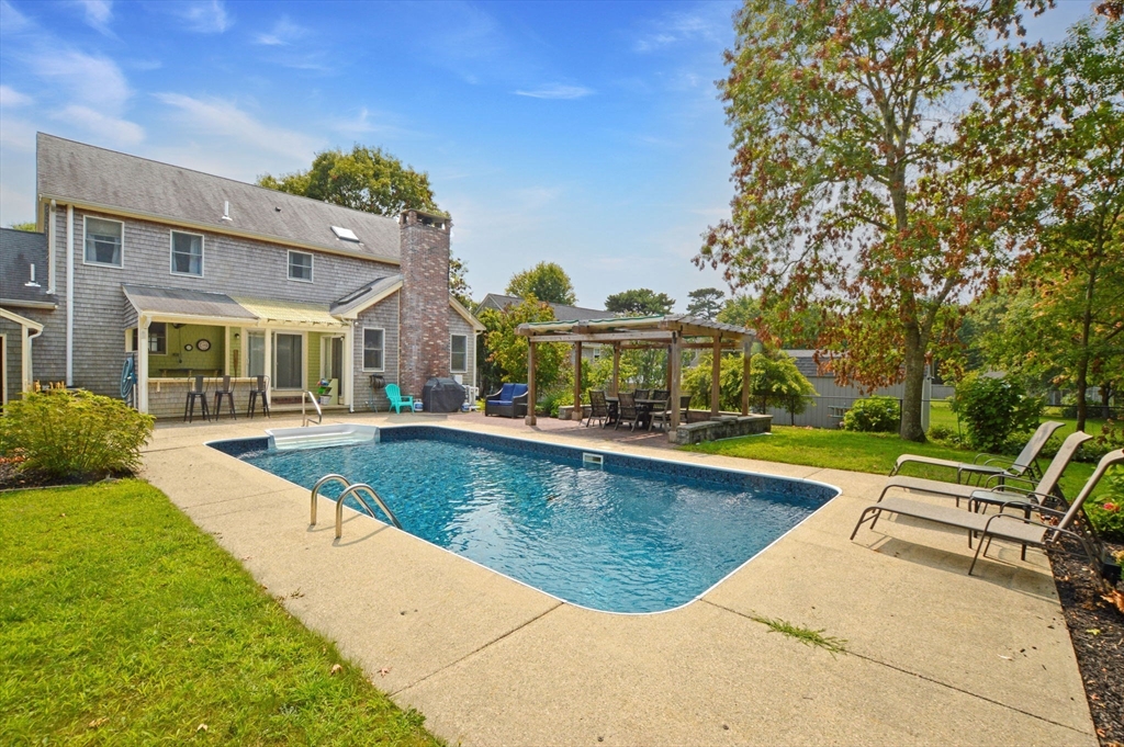 48 Tara Terrace Bourne, MA 02532 - Photo 6 of 33 a view of a house with swimming pool and sitting area