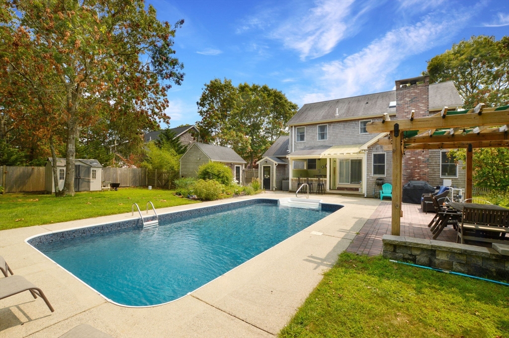 48 Tara Terrace Bourne, MA 02532 - Photo 7 of 33 a view of a house with swimming pool