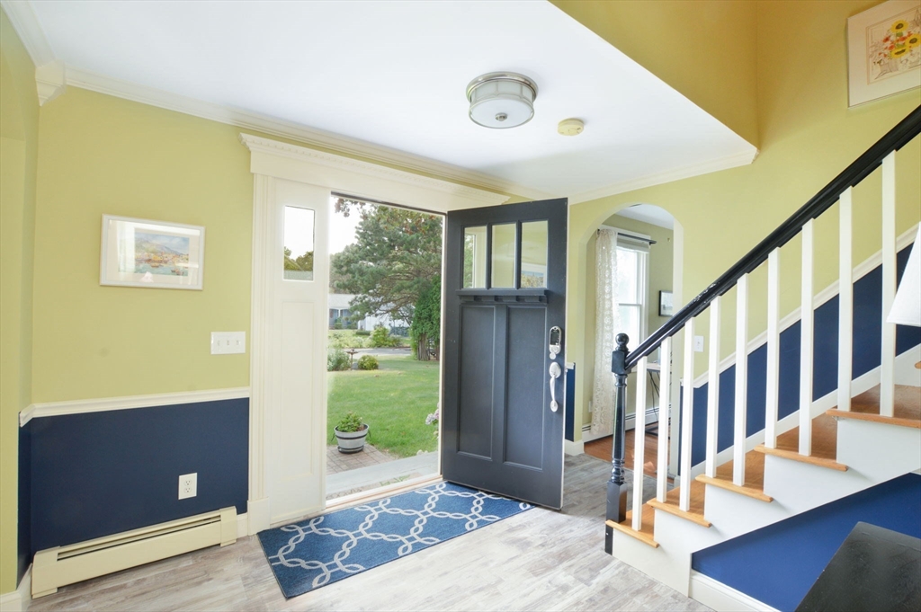 48 Tara Terrace Bourne, MA 02532 - Photo 8 of 33 a view of an entryway with wooden floor and windows