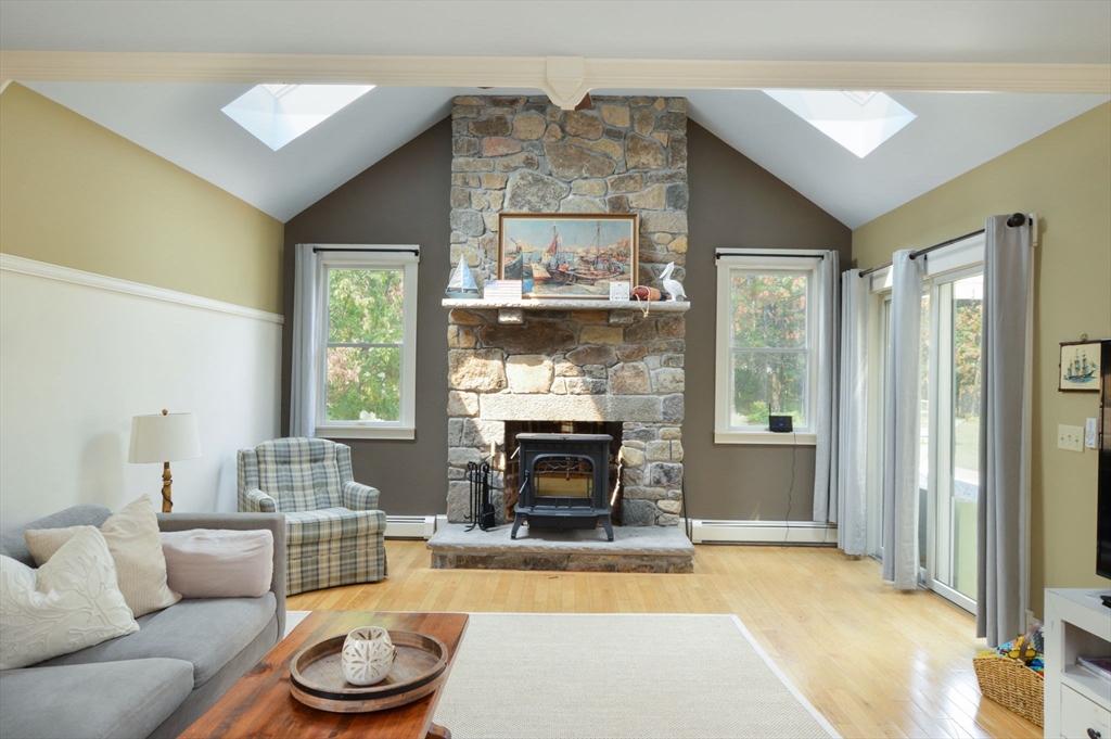 48 Tara Terrace Bourne, MA 02532 - Photo 10 of 33 a living room with furniture and a fireplace