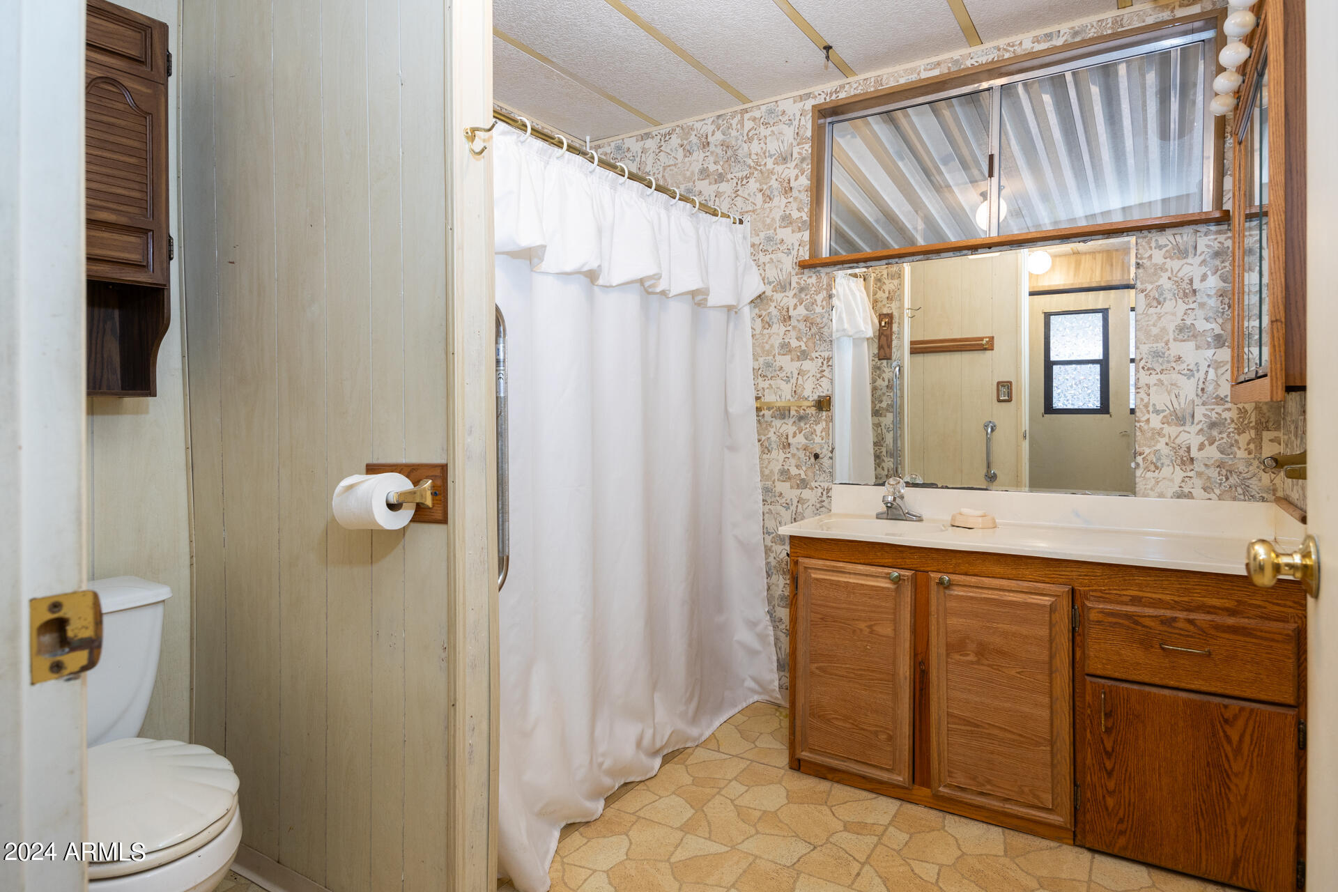 2100 North Trekell Road, Unit 148 Casa Grande, AZ 85122 - Photo 14 of 36 a bathroom with a sink a toilet and shower