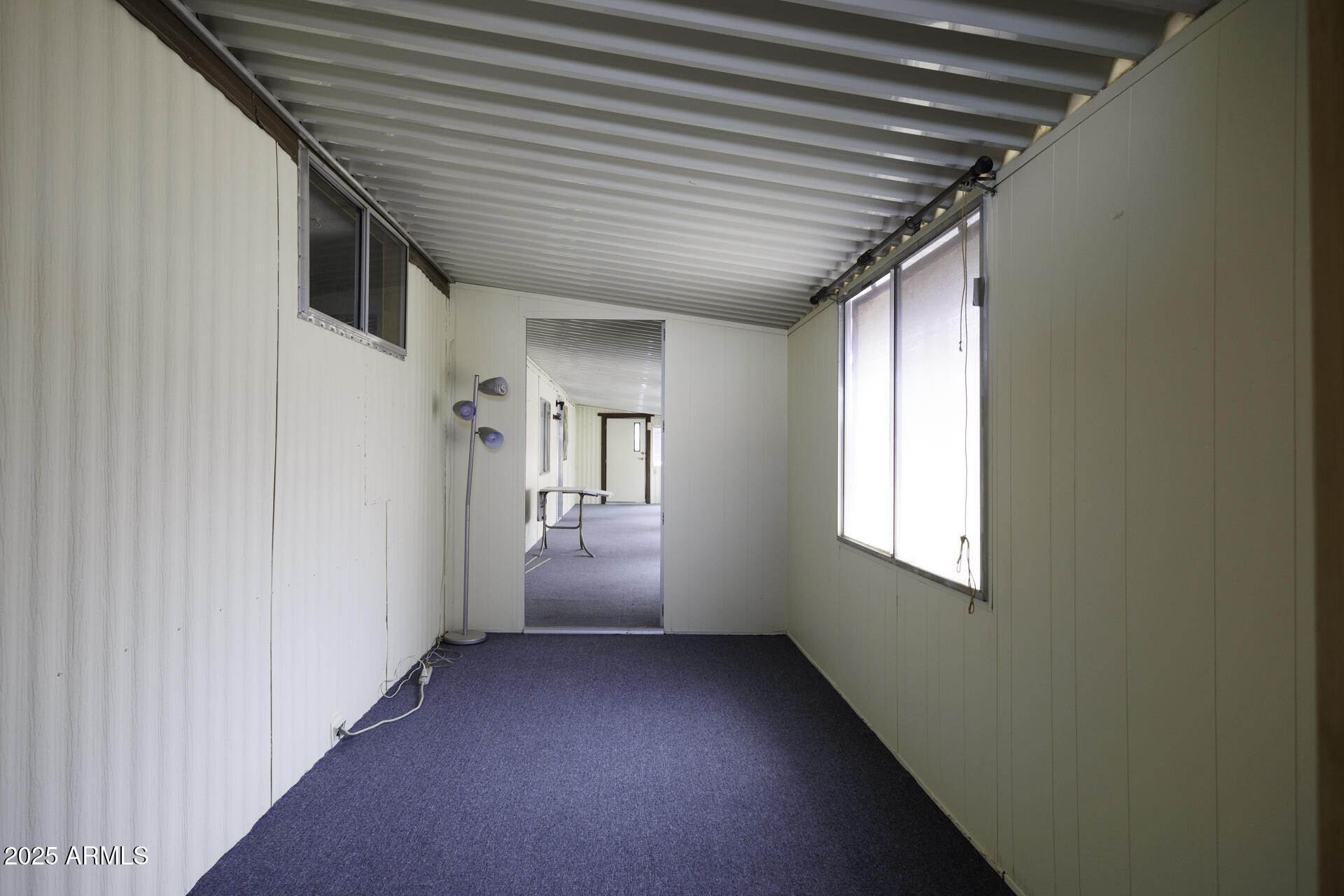2100 North Trekell Road, Unit 148 Casa Grande, AZ 85122 - Photo 19 of 36 a view of a hallway with windows