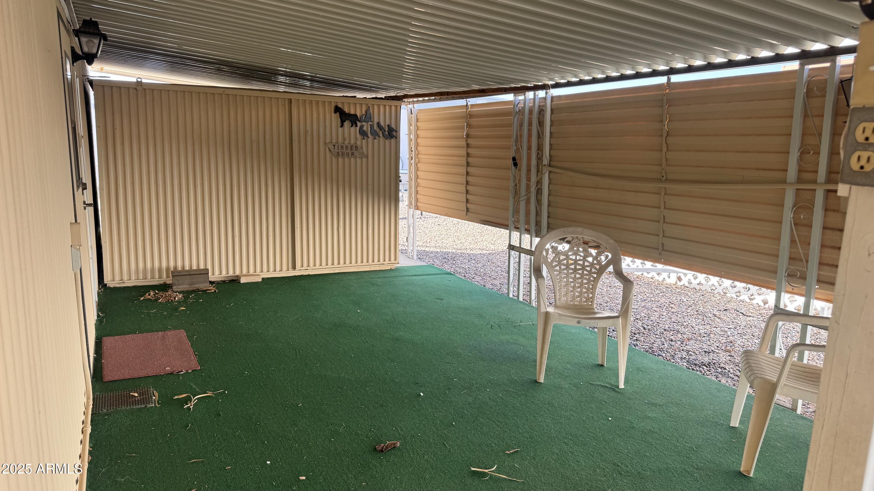 2100 North Trekell Road, Unit 148 Casa Grande, AZ 85122 - Photo 23 of 36 a backyard of a house with table and chairs