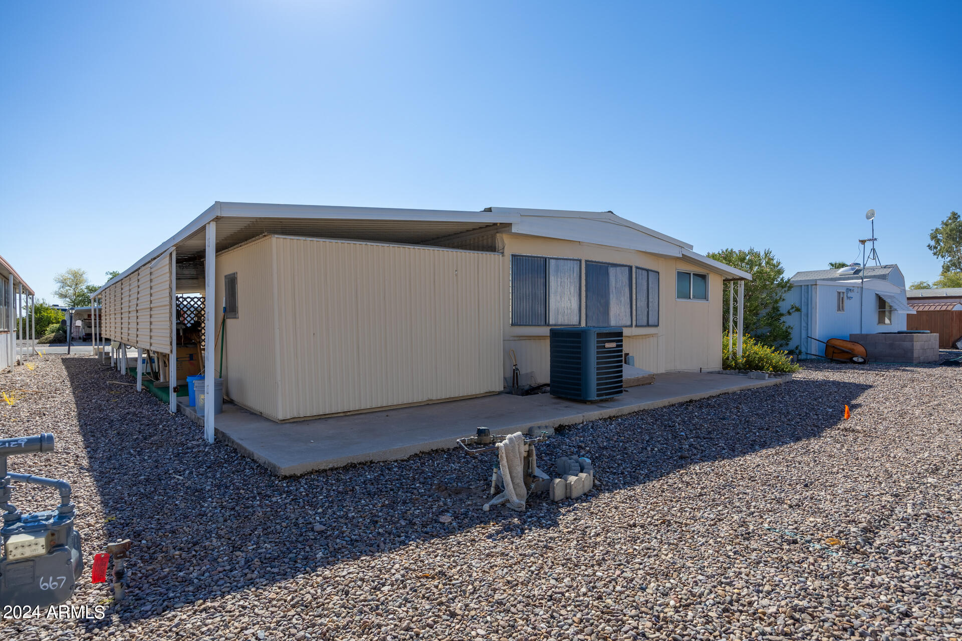 2100 North Trekell Road, Unit 148 Casa Grande, AZ 85122 - Photo 26 of 36 a view of a house with backyard
