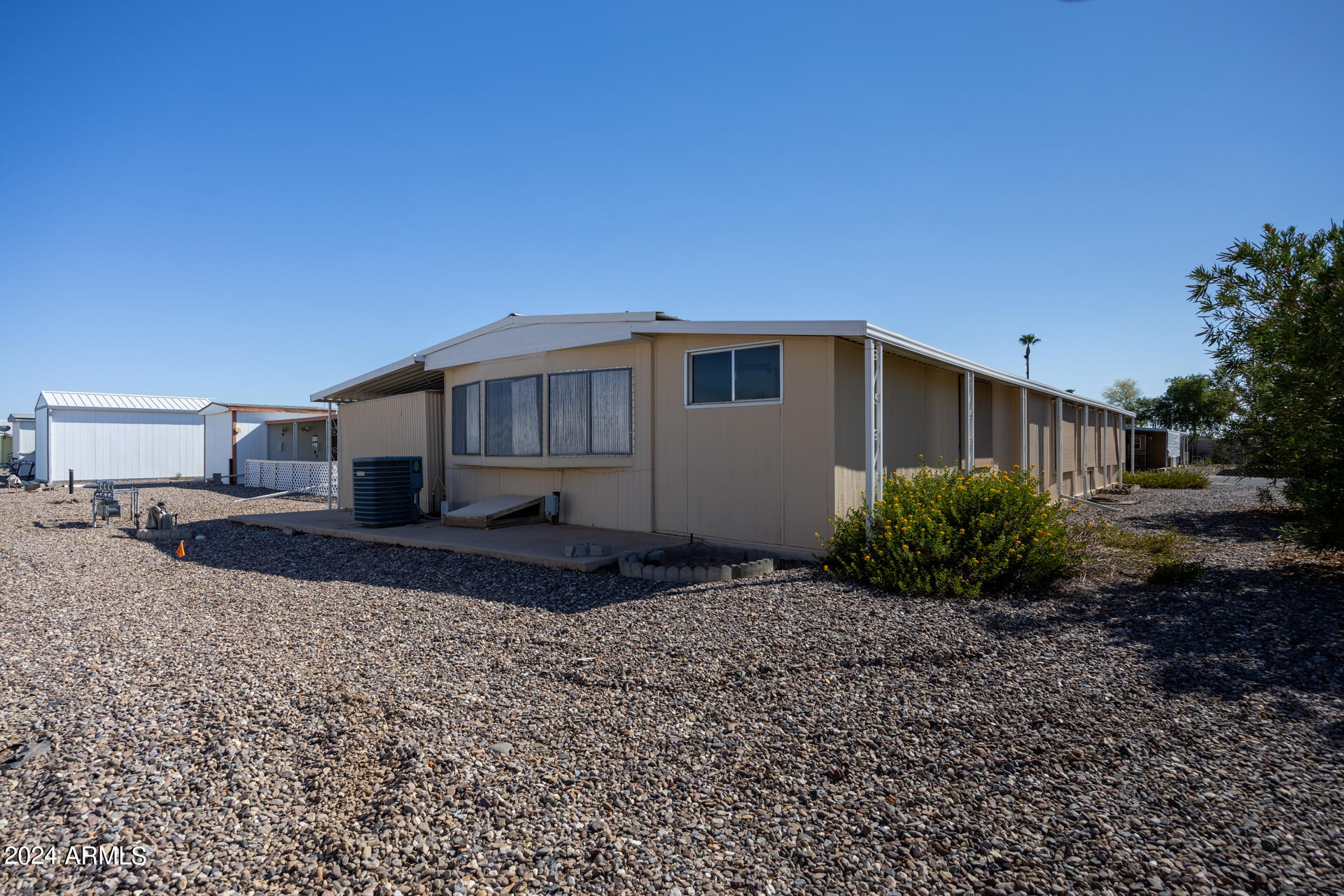 2100 North Trekell Road, Unit 148 Casa Grande, AZ 85122 - Photo 27 of 36 a house view with a backyard space