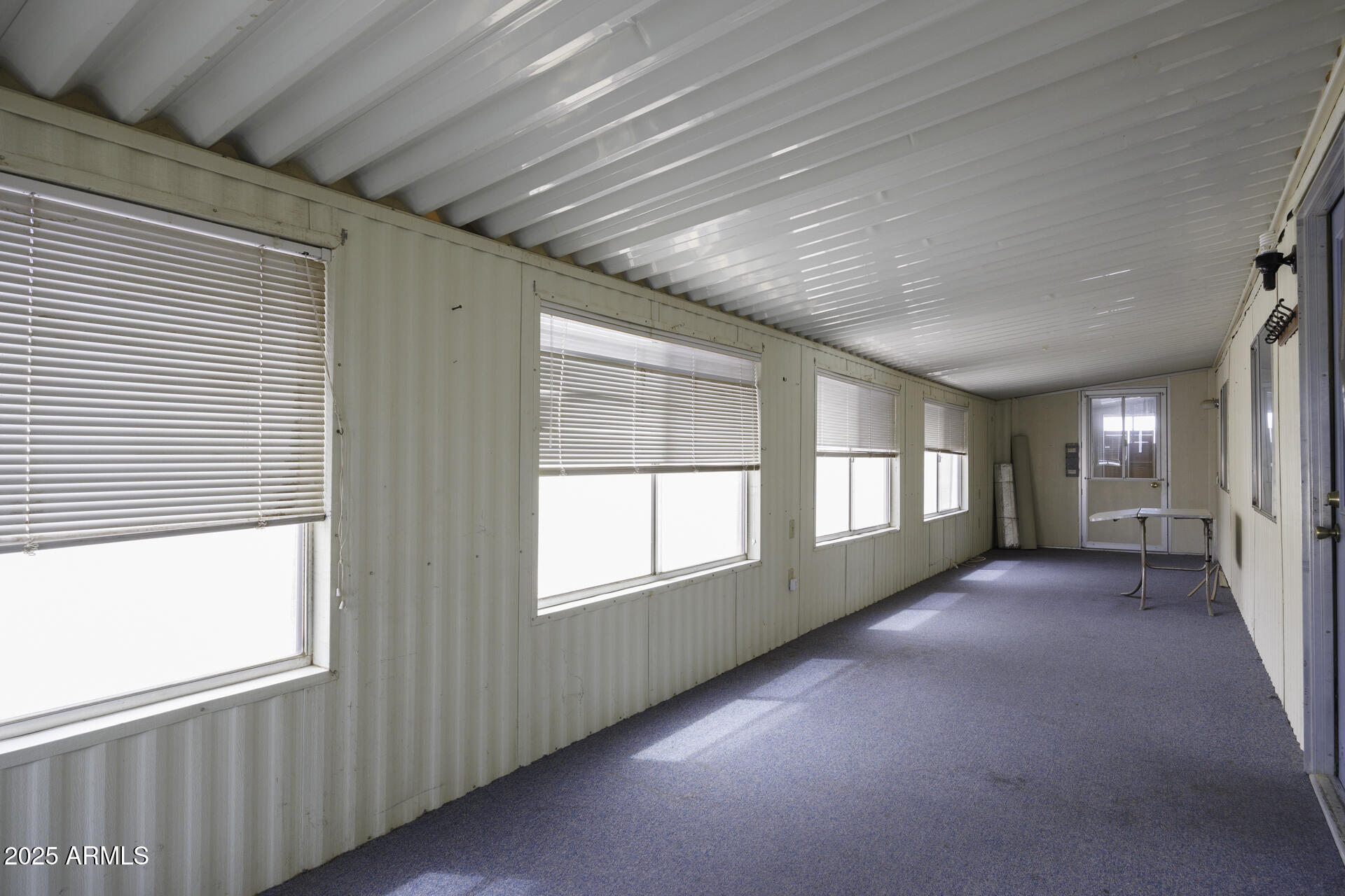 2100 North Trekell Road, Unit 148 Casa Grande, AZ 85122 - Photo 5 of 36 an empty room with windows