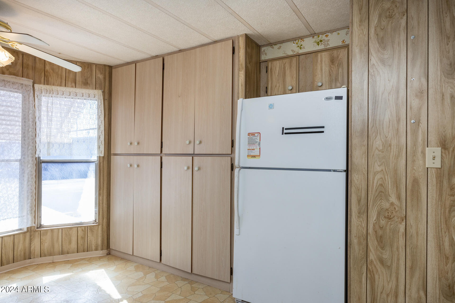 2100 North Trekell Road, Unit 148 Casa Grande, AZ 85122 - Photo 10 of 36 a white refrigerator freezer and a granite counter top