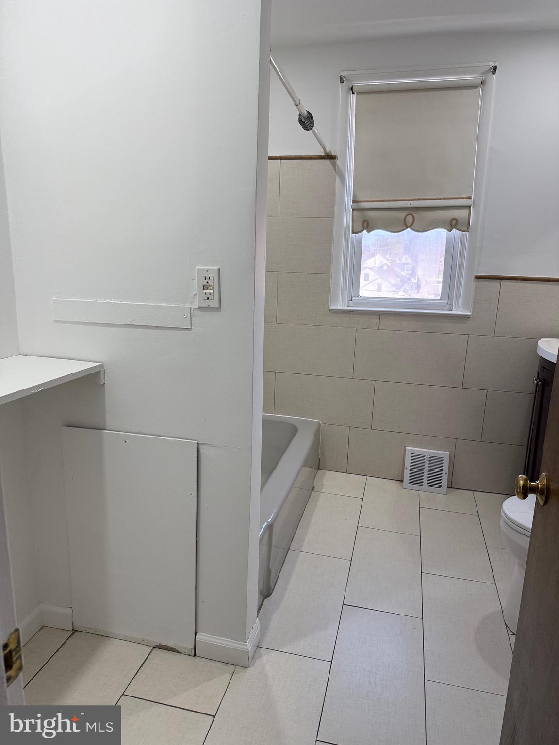 9083 Convent Avenue Philadelphia, PA 19136 - Photo 12 of 22 a bathroom with a bathtub and shower