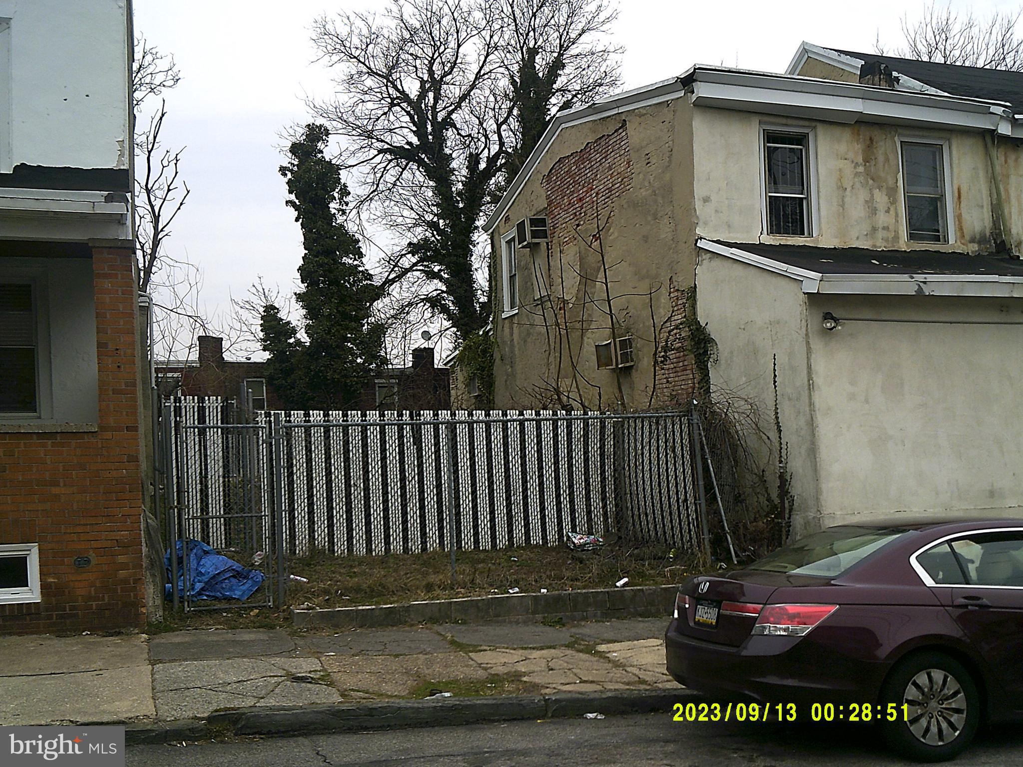 5527 Sprague Street Philadelphia, PA 19138 - Photo 2 of 2 a view of a house with a small yard and wooden fence