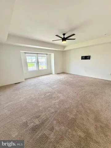 a view of a livingroom with a ceiling fan