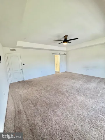 a view of a livingroom with a dishwasher and a window