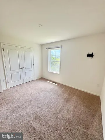 a bathroom with a sink a toilet a mirror and shower