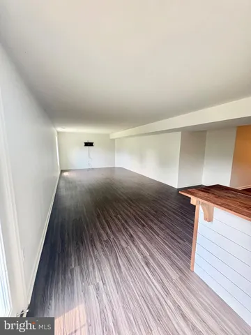 a view of a swimming pool with an outdoor seating