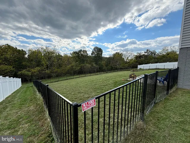 a view of a lake with a yard
