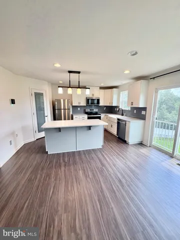 a view of wooden floor in an empty room