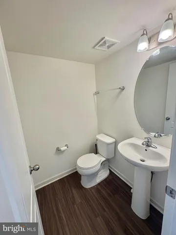 an empty room with a fireplace and a vanity