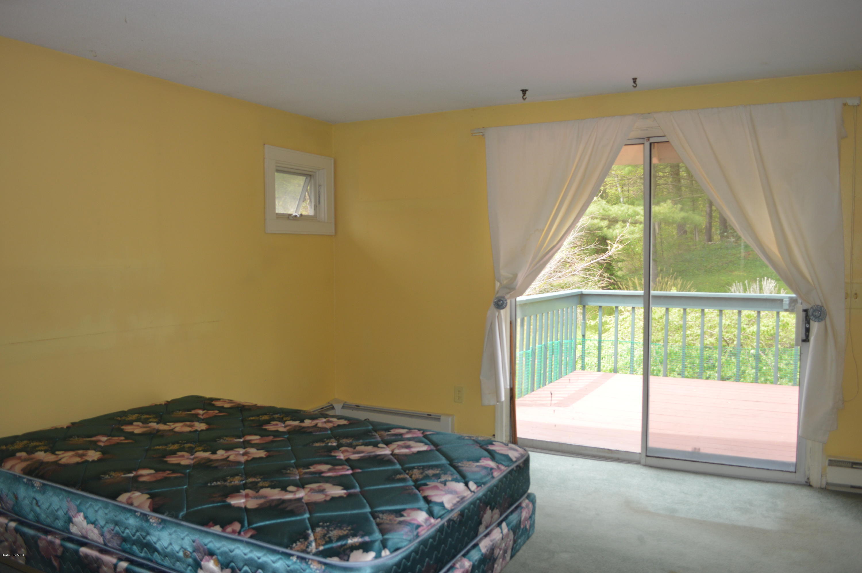 2131 Dublin Road Richmond, MA 01254 - Photo 16 of 51 a bed sitting in a bedroom next to a window
