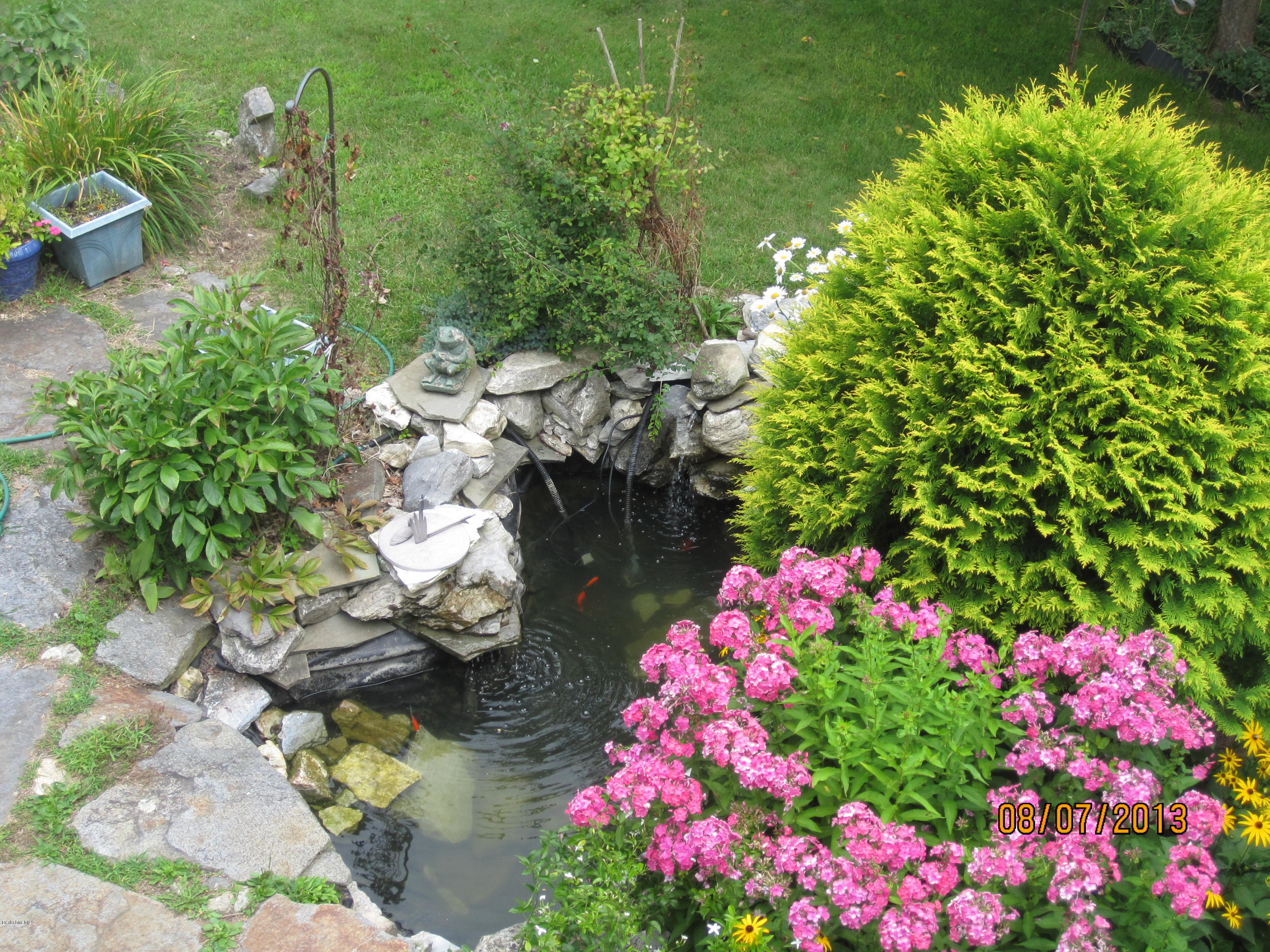 2131 Dublin Road Richmond, MA 01254 - Photo 28 of 51 a small yard with fountain and flowers