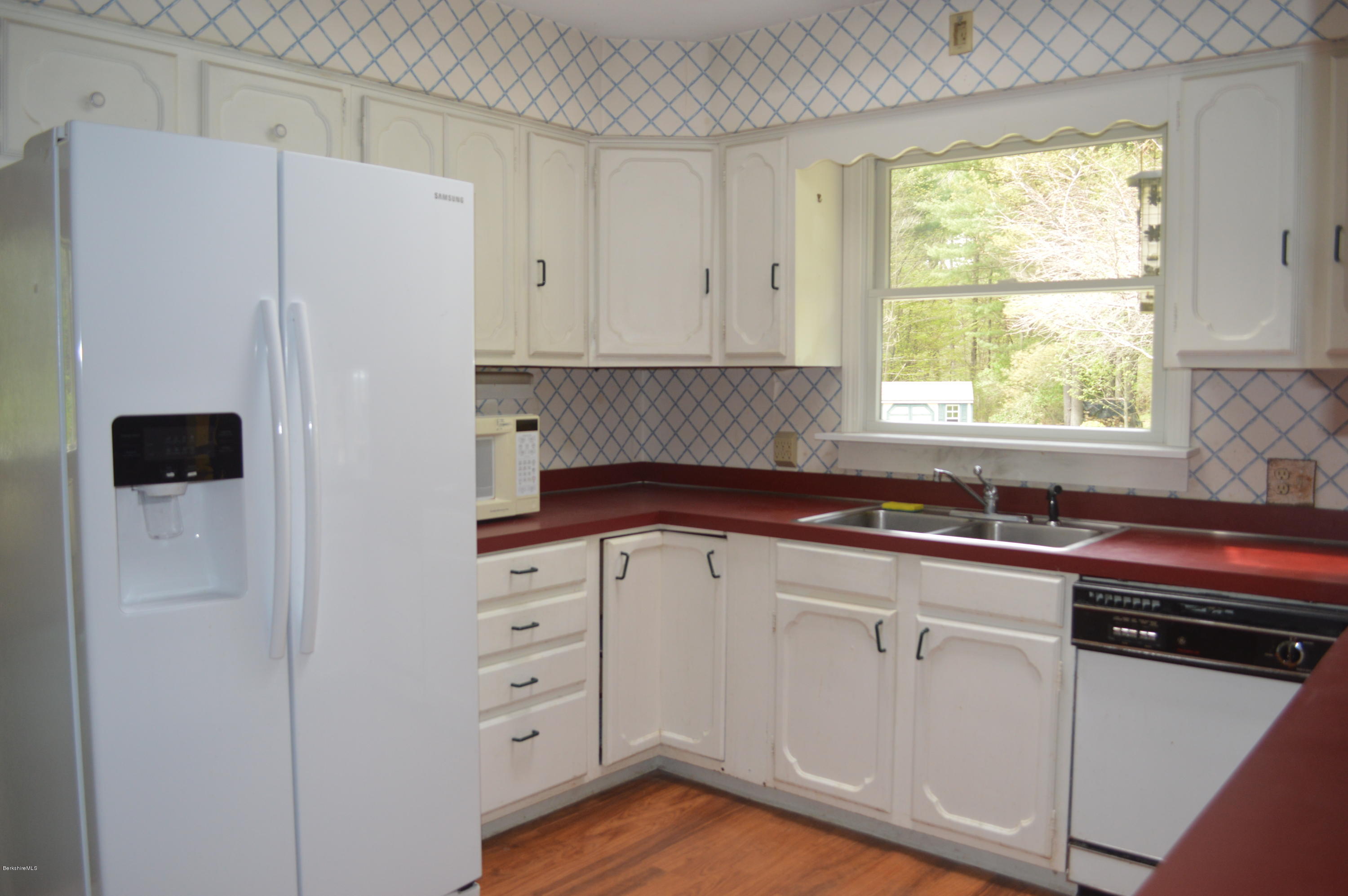 2131 Dublin Road Richmond, MA 01254 - Photo 5 of 51 a kitchen with white cabinets and white appliances