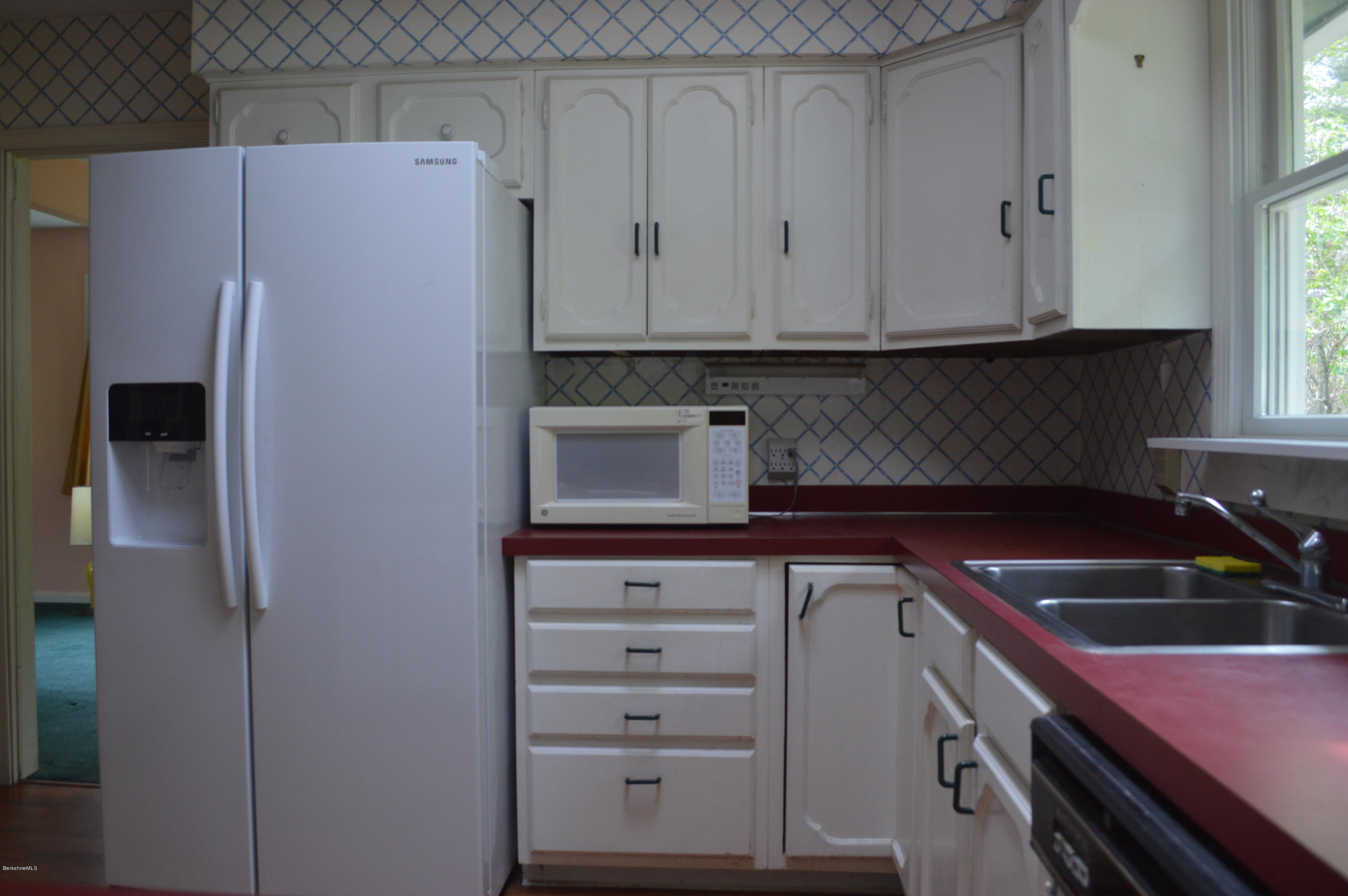 2131 Dublin Road Richmond, MA 01254 - Photo 6 of 51 a kitchen with a refrigerator and cabinets