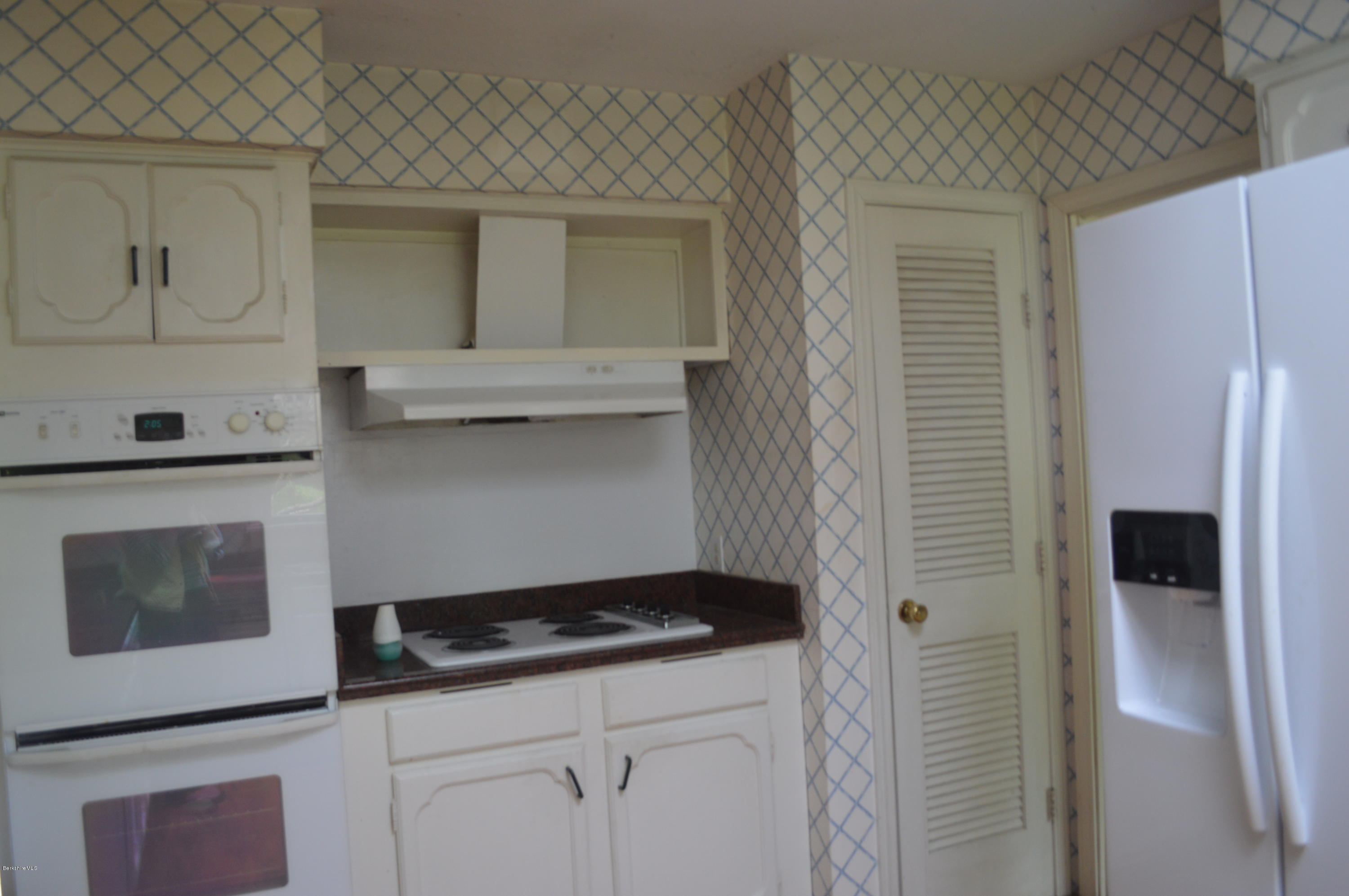 2131 Dublin Road Richmond, MA 01254 - Photo 8 of 51 a kitchen with a sink and a refrigerator
