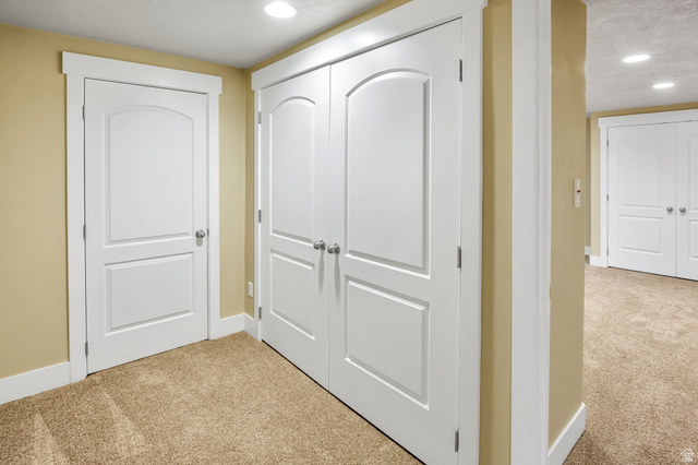 1320 Canyon Park Road Bountiful, UT 84010 - Photo 19 of 28 Corridor with light colored carpet and recessed lighting