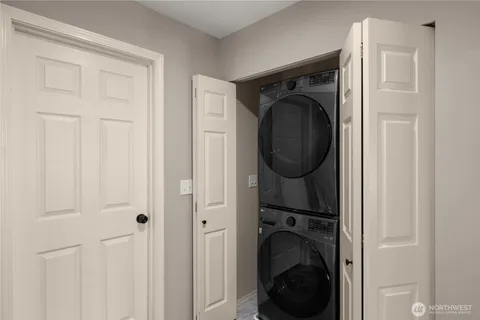 a view of a hallway with washer and dryer