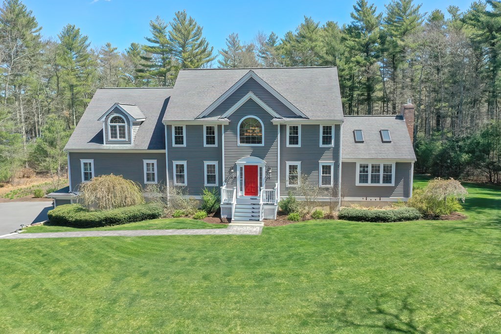 101 Paradise Lane Rochester, MA 02770 - Photo 1 of 42 a front view of a house with a yard and garage