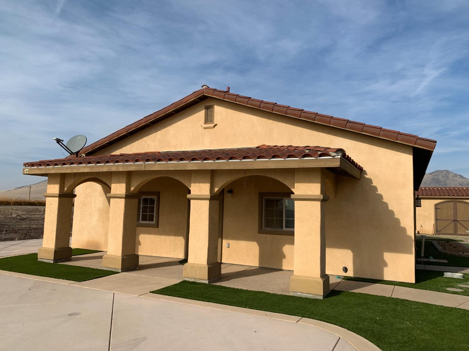 1662 South Alta Avenue Reedley, CA 93654 - Photo 12 of 30 a front view of a house with a yard