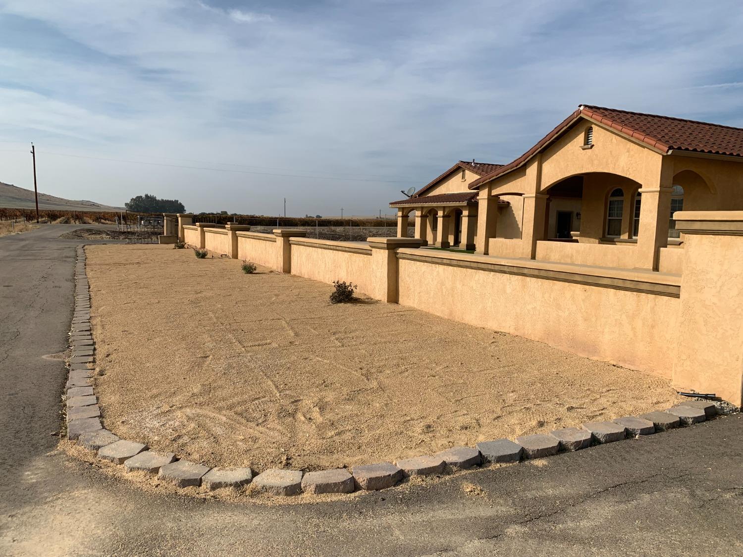1662 South Alta Avenue Reedley, CA 93654 - Photo 15 of 30 a front view of a house with a yard