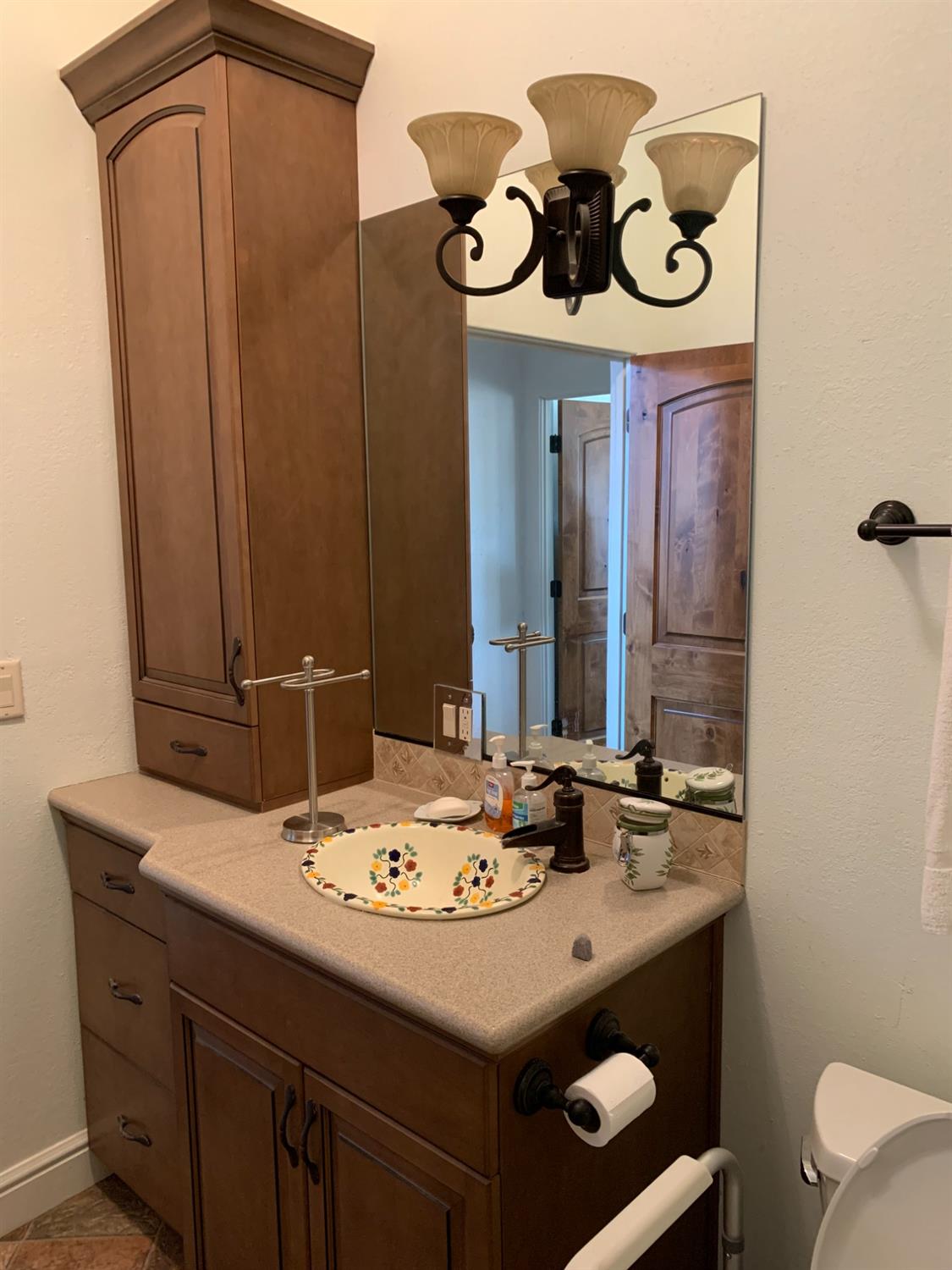 1662 South Alta Avenue Reedley, CA 93654 - Photo 25 of 30 a bathroom with a sink and a mirror