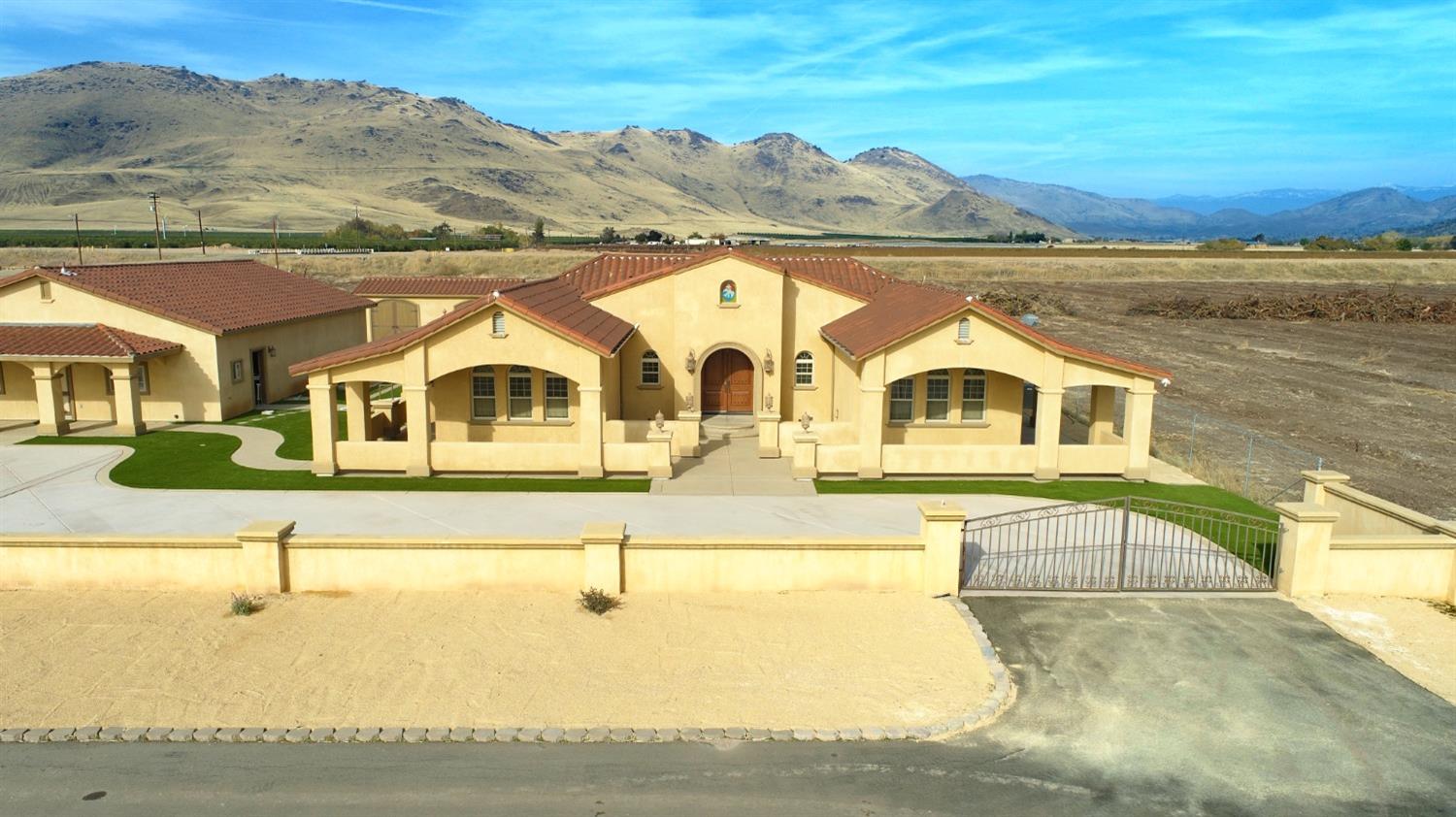 1662 South Alta Avenue Reedley, CA 93654 - Photo 9 of 30 a front view of a house with a yard