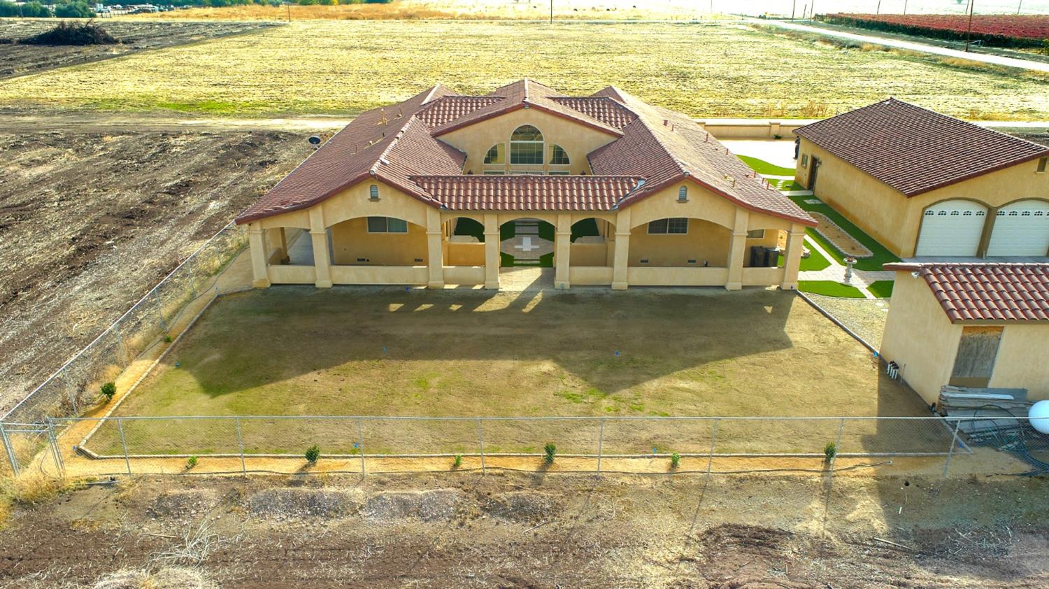 1662 South Alta Avenue Reedley, CA 93654 - Photo 10 of 30 a front view of a house with a yard