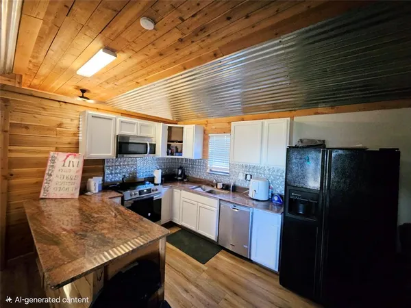 a kitchen with lots of counter space and appliances
