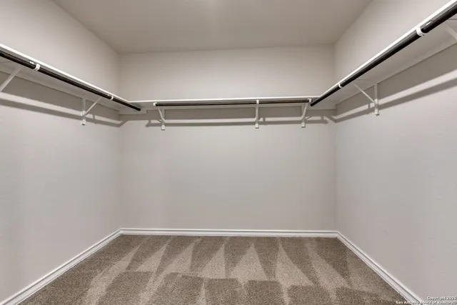a view of an empty walk in closet
