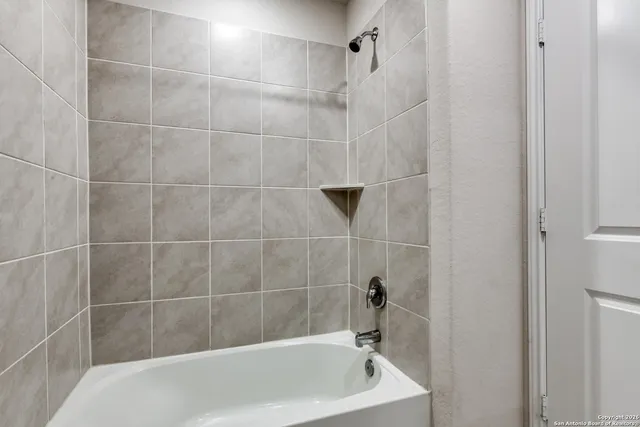 a bath tub sitting next to a bathroom